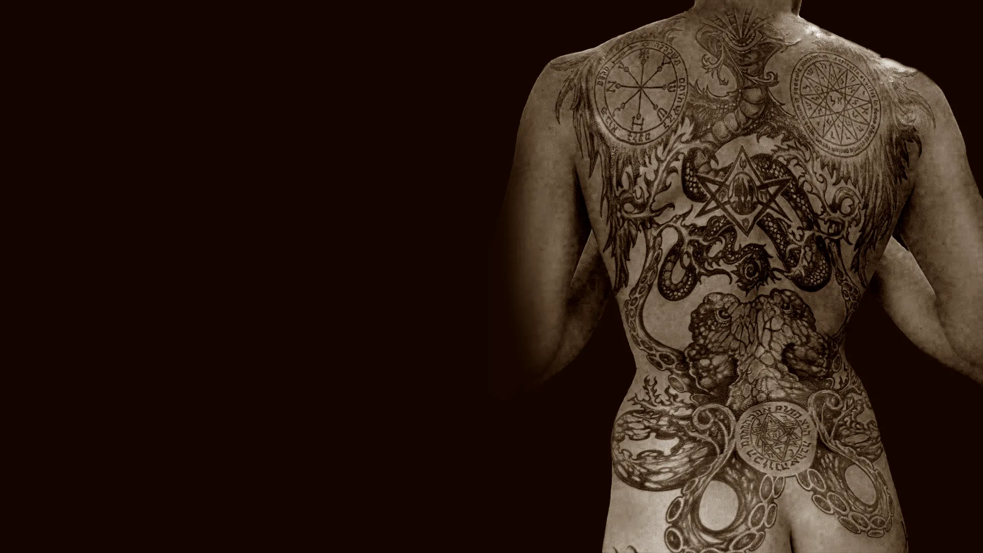 Person with large back tattoo.